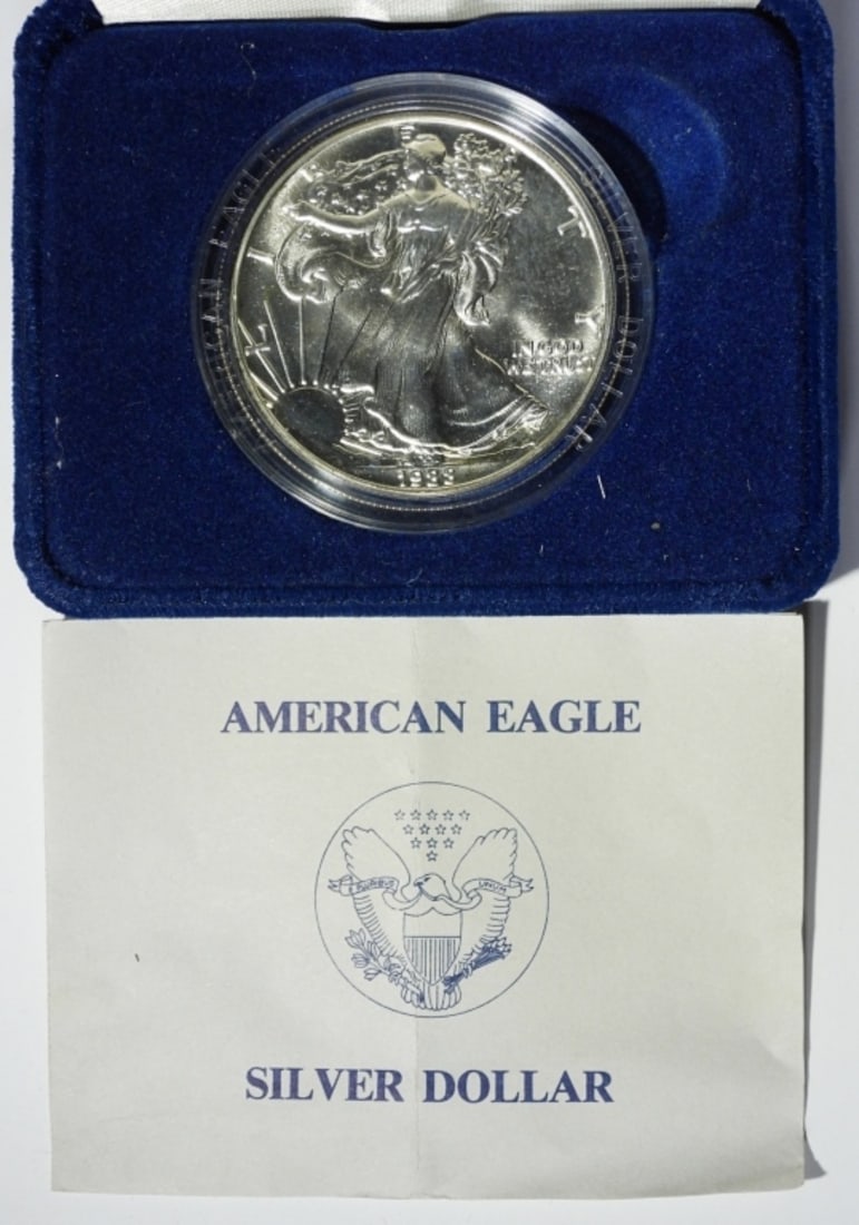 1988 UNC AMERICAN SILVER EAGLE: IN VELVET DISPLAY CASE WITH COA. MISSING OUTER BOX.