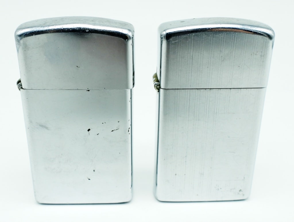 (2) ZIPPO SLIM LIGHTERS: 1-1974 USED CONDITION CAP LITTLE LOOSE, 1-1975 USED CONDITION, ETCHED DESIGN