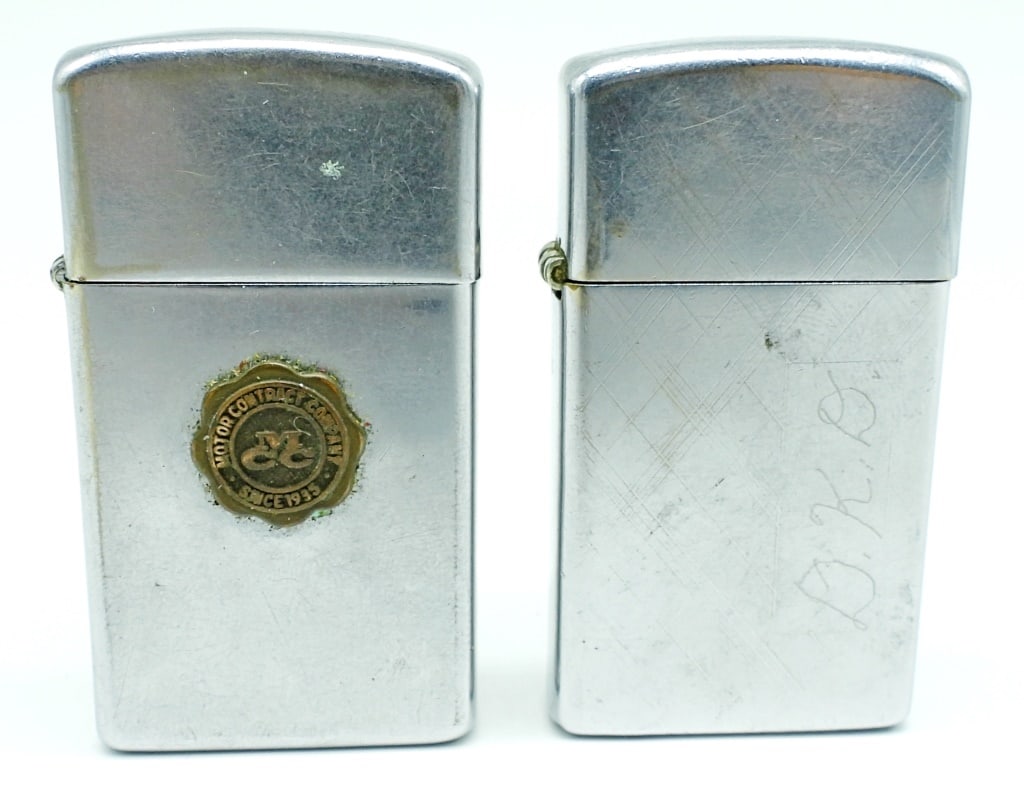 (2) ZIPPO SLIMG LIGHTERS: 1- 1968 USED CONDITION, " MOTOR CONTRACT COMPANY SINCE 1935" ON THE FRONT, 1-1975 ETCHED DESIGN CRAVED "D.K.D"