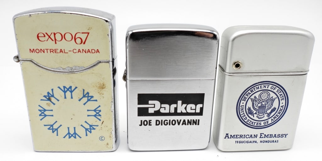 (3) ADVERTISING LIGHTERS IN BOXES: 1- 1963 FISHER LIGHTER USED CONDITION "EXPO 67 MONREAL-CANADA", 1- PARK LIGHTER " PARKER JOE DIGIOVANNI" USED CONDITION, 1 STORM MASTER LIGHTER " DEPARTMENT OF STATE UNITED STATES OF AMERICA, AMERICAN