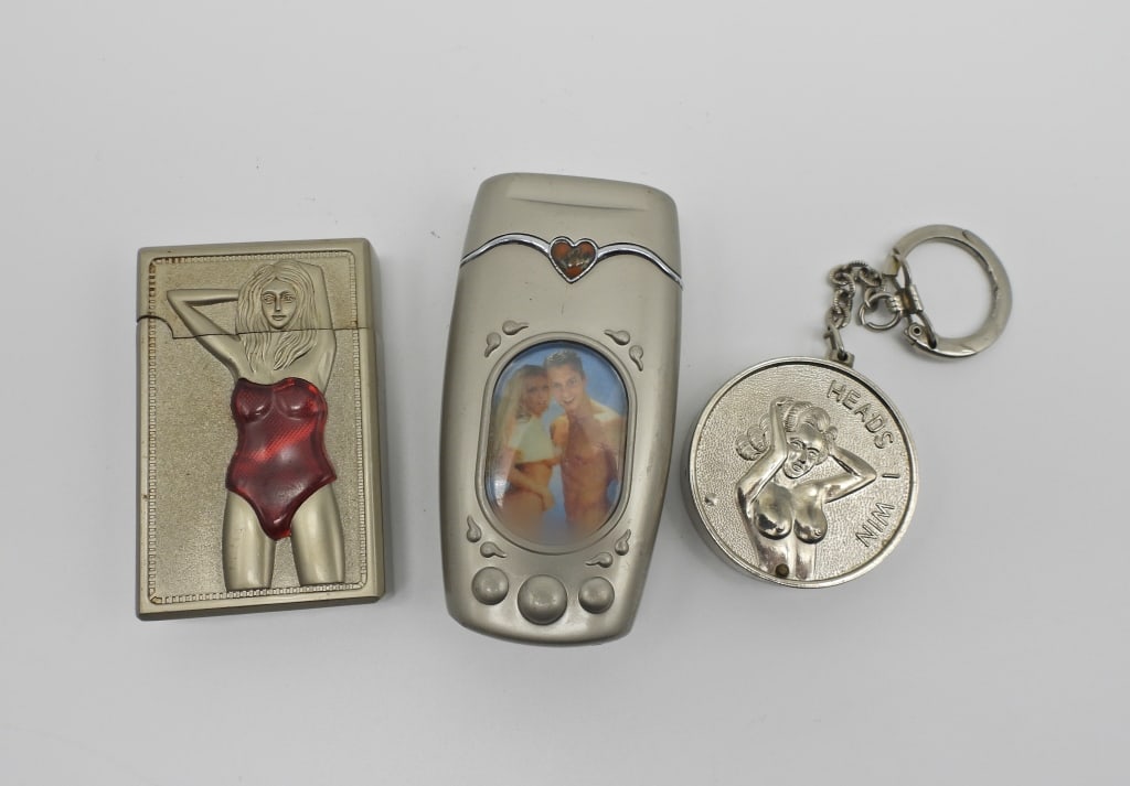 (3) ADULT LIGHTERS LOT: 2- ELECTRIC LIGHTERS, 1- KEYCHAIN LIGHTER- USED CONDITION