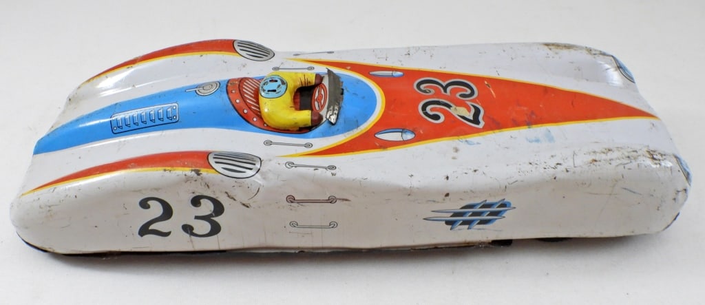 VINTAGE TIN RACE CAR #23: 10 1/2IN LONG, HEAD FROM DRIVE IS MISSING AND SCRATCHES AND DINGS ALL AROUND THE TOY, NO BRAND STAMPING FOUND