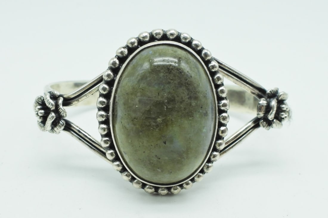 STERLING MOONSTONE FLOWER CUFF BRACELET: 22.2DWT, 2 1/2" WIDE, MOONSTONE IN THE MIDDLE WITH A FLOWER ON EACH SIDE AND ROPE DESIGN, STAMPED 925 ON THE INSIDE