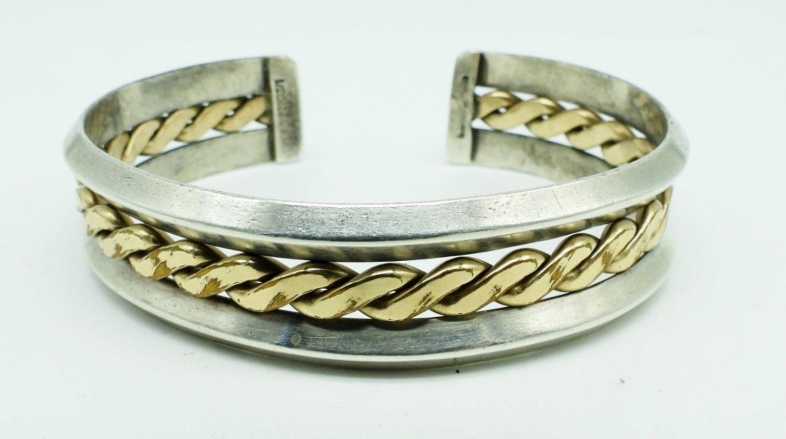 STERLING & 12KGF CUFF BRACELET: 26.2DWT, STAMPED STERLING AND 12KGF ON THE INSIDE,GOLD FILLED DESIGN IN THE MIDDLE
