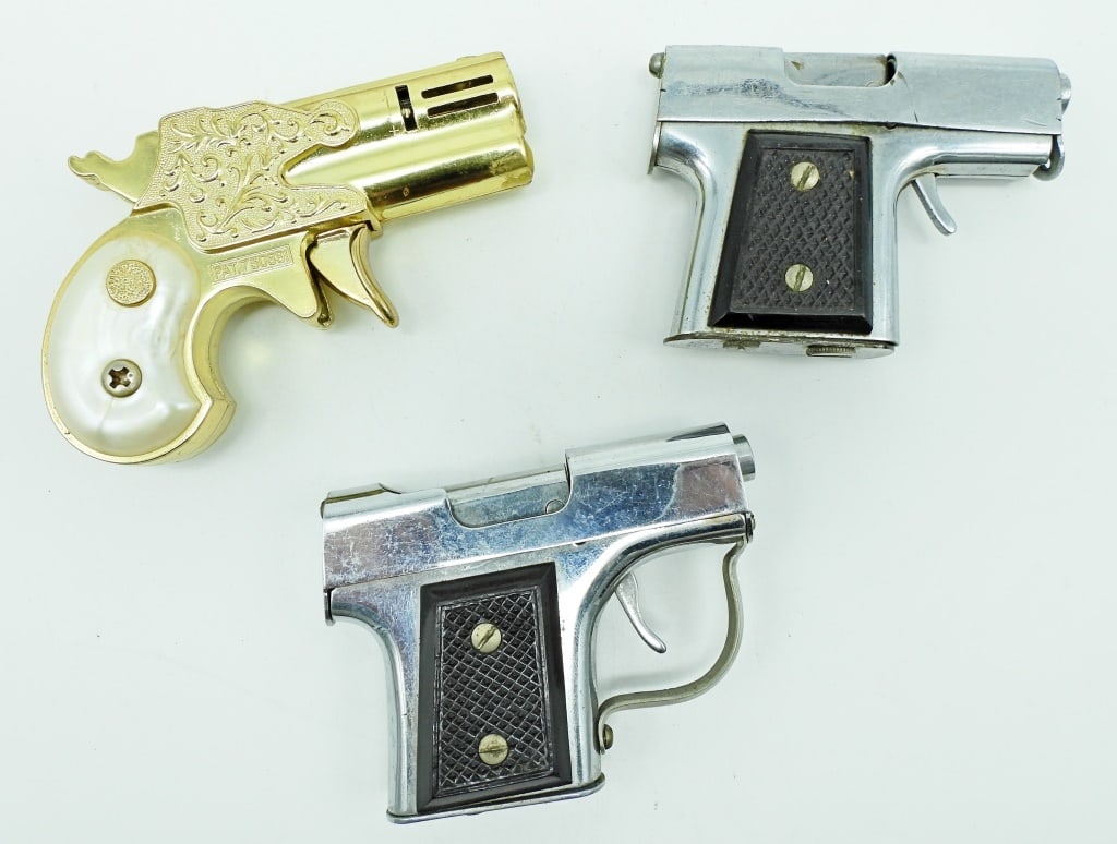 (3) LIGHTER GUNS: 1- GOLD TONE WITH WHITE MOTHER-OF-PEARL STYLE ON HANDLE , MARKED MODERN ANGELMASCOT PAT.730891,2- UNFIRED 1 TRIGGER GETS STUCK BUT DOES CLOSE IF YOU PUSH TIGGER UP NO MARKING