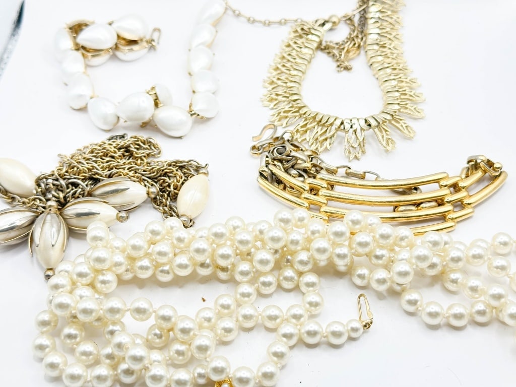 (5) GOLD TONE NECKLACES: 1- 60" LONG LAYERED FAUX PEARL NECKLACE, 1- FESTOON GOLD TONE 18" LONG W/HOOK CLAP, 1- TRIFARI FAUX PEARL GOLD TONE CHOKER 16" LONG W/ HOOK CLASP STAMPED WITH MAKER, 1-FOLD TONE NECKLACE 18" LONG, 1-3