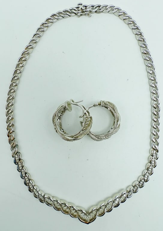 CLEAR STONE STERLING NECKLACE AND EARRING SET: 26.4DWT, PIERCED HOOP BREADED DESIGN, STAMPED 925 CZ THAILAND, 14" LONG NECKLACE WITH BOX CLASP, CLEAR STONE MAKE "V" IN THE MIDDLE. STAMPED 925