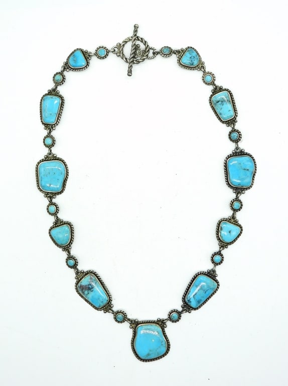 Turquoise Colored Stone Necklace Sterling: Irregular flat nugget shaped turquoise colored stone in Sterling twisted rope setting. Very Lovely!