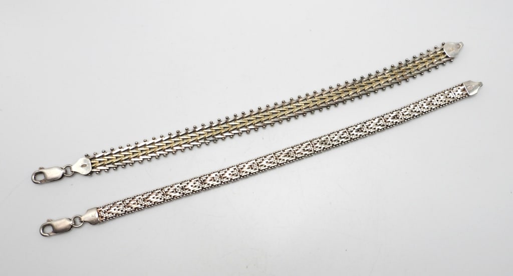 Vintage Italian Sterling Tennis Bracelet Set: One Italian 7 nich tennis bracelet with gold overlay in the center, and one Sterling silver 7 inch bracelet. Both with working clasps. Mild Tarnishing, but would be stunning fully restored. (17 DWT)