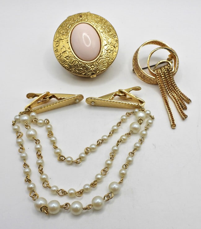 (3) Gold Tone Vintage Ladies Lot - Knot Brooch,: Faux Pearl Sweater Clip, Round Floral Embossed Hinge Lid Pill/Trinket Box; Used.