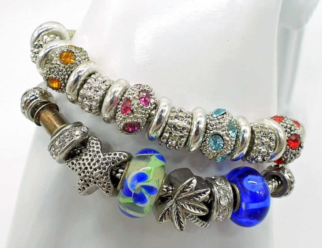 Two Silver Tone Charm Bracelets: Multicolored rhinestone charms and beach motif. 7 inches