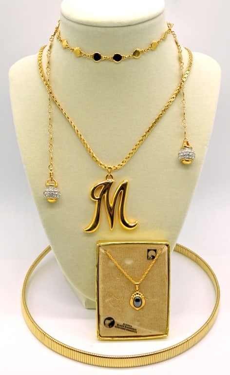 Vintage Gold Tone Necklaces: Four necklaces in various lengths. 'M' monogram, hematite pendant, and more.