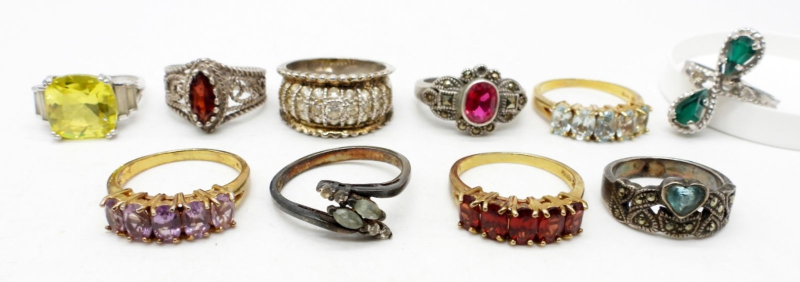 (10) STERLING SILVER & GOLD TONE RINGS: BLING FASHION RINGS WITH RHINESTONES OF VARIOUS COLORS; SIZES VARY 6-9; STAMPED 925, 925 CHINA, STERLING; 28 DWT