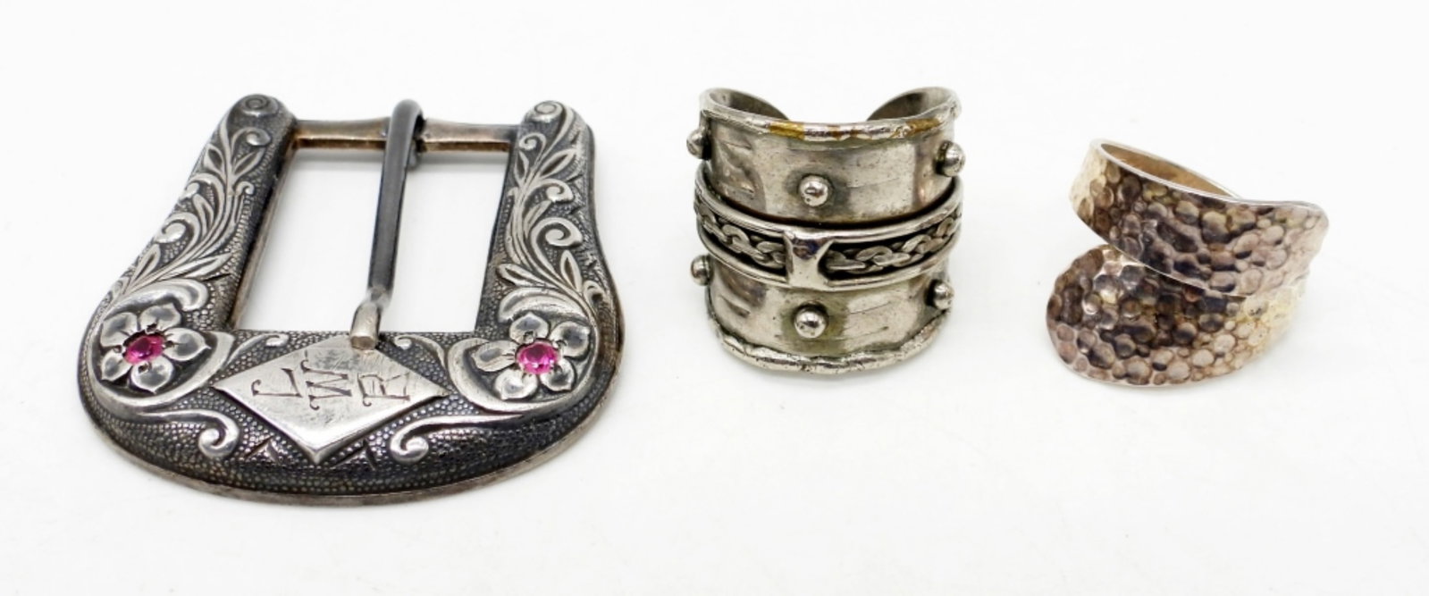 925 Southwest Rings & Buckle: Belt buckle with pink stones, plus two size 8 adjustable rings. DWT 20
