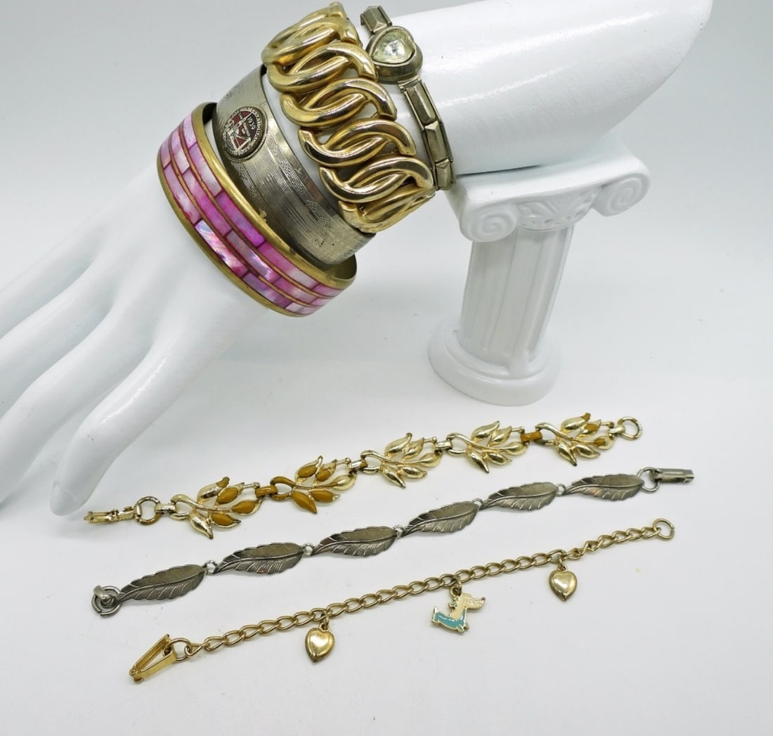 7 Assorted Bracelets: Various styles and colors. 5-7 inches. Gold tone and silver tone.