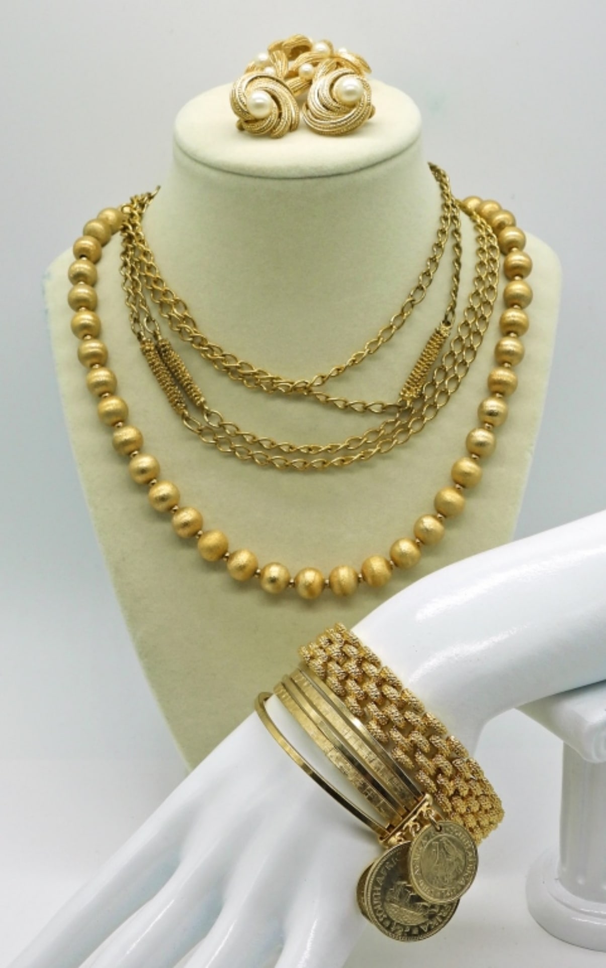 6 Piece Textured Gold Tone Set of Jewelry: Textured Gold Tone. 2 necklaces 18 & 30 inches. Bangle with Dangling Coins, Textured Bracelet, Clip on Earrings & Brooch