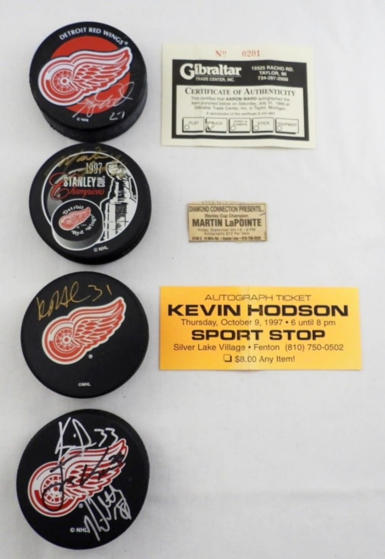 (4) NHL RED WINGS AUTOGRAPH PUCKS (1 of 2)