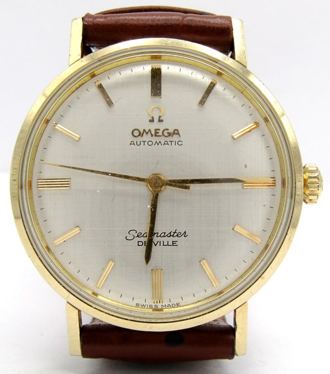 Omega Seamaster Deville: Ref LL 6066, Nice Silver Linen Dial, 17 Jewel Cal 550 Movement, 34mm Diameter, Stainless Logo Case with Gold Bezel and Lugs. New Strap; Working at time of listing.