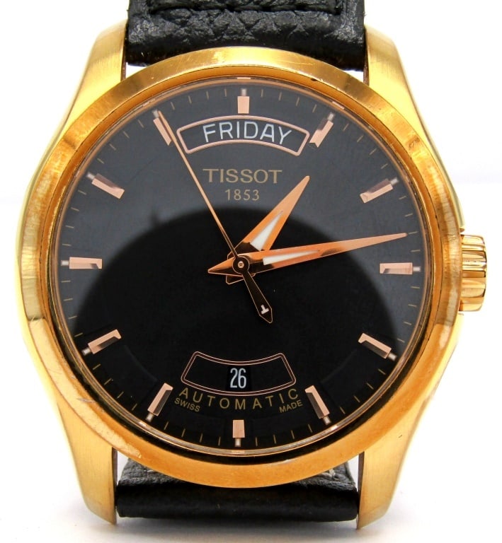 GENTS Tissot Day/Date Automatic: Gold Plated PVD Case, 41mm Diameter, 25 Jewel Automatic Movement. Complete with what appears to be an Original Leather Strap and Signed Deployment Clasp. This watch has very little use; Working at tim