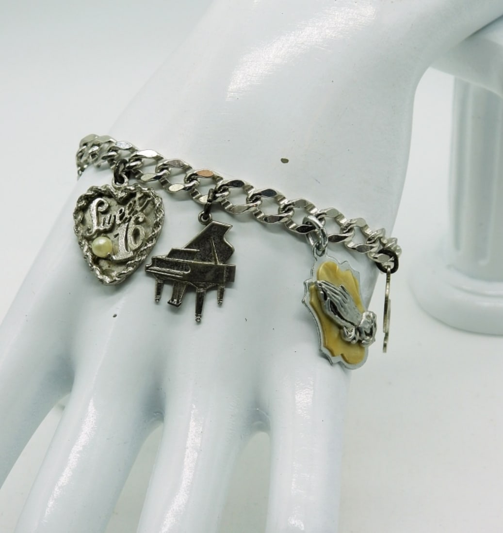 925 Charm Bracelet circa 1969-7 Charms: Sterling Charm Bracelet with 7 Sterling Charms. Circa 1969 15.6 DWT
