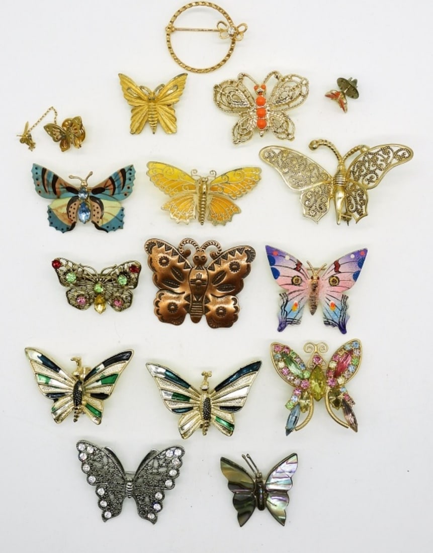 16 Butterfly Pins: Sixteen Butterfly Pins in Gemstones, Abalone, Painted & Filigree Designs. The largest is 3"x 2". 15 in Gold Tone and 1 in Silver Tone
