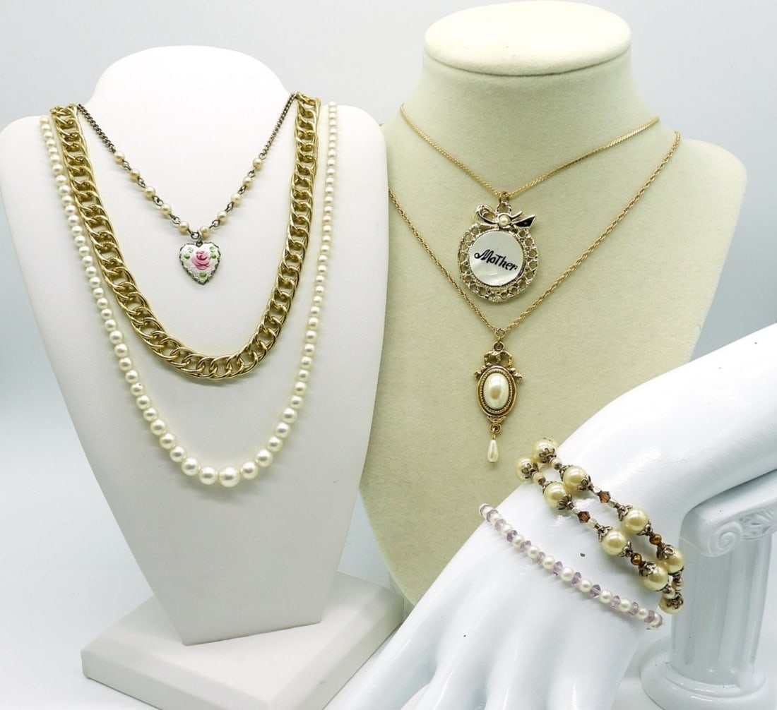 5 Goldtone & Pearl Necklaces and Bracelets: Goldtone 16" chain, Goldtone 14" chain with round goldtone pendant with a mother of pearl inlay and "Mother" inscribed (pendant 1"x1"). Silvertone 14" chain with faux pearls and a heart pendant with p