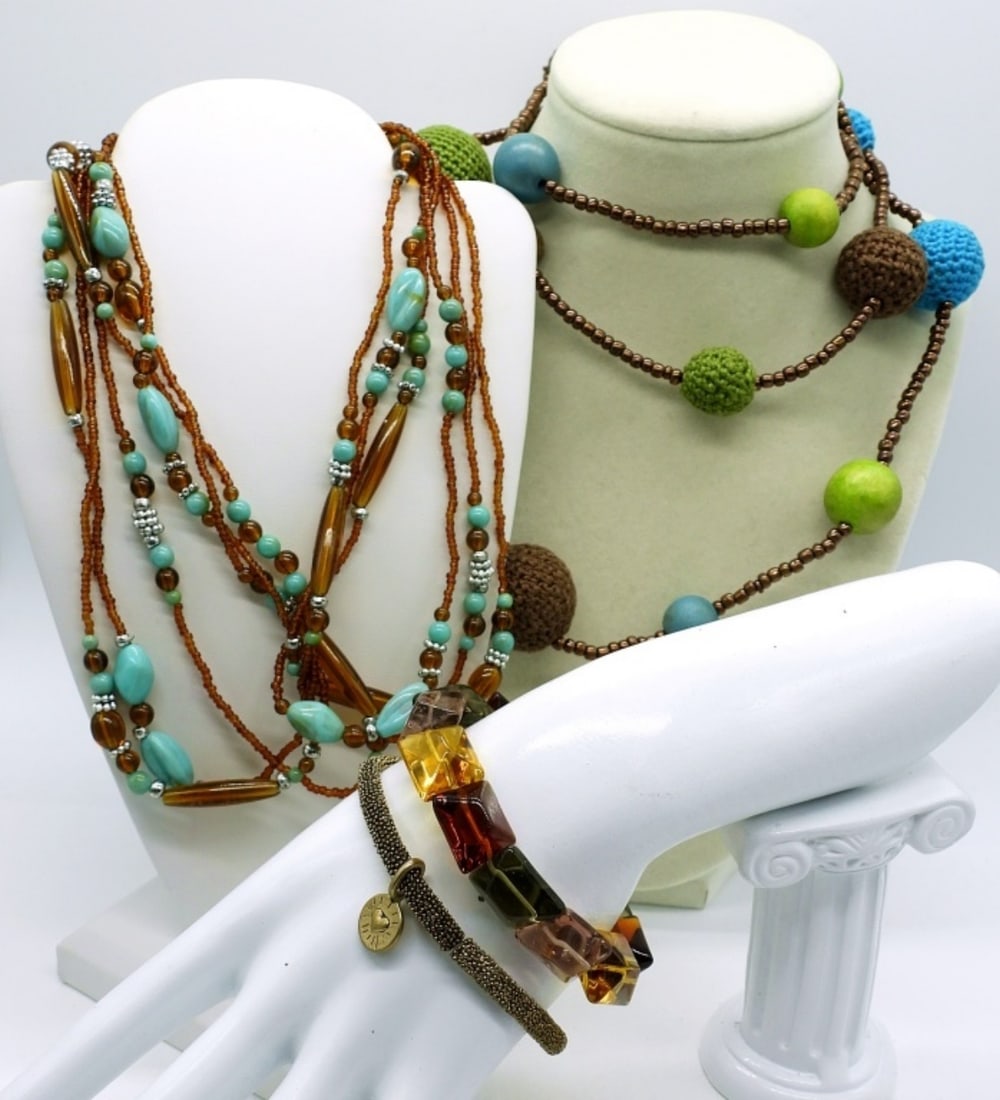 Beaded Earthtones-4 Pieces: Two beaded necklaces in browns, blues and greens. 34" & 48". Two bracelets, stretchy, 7" & 8".