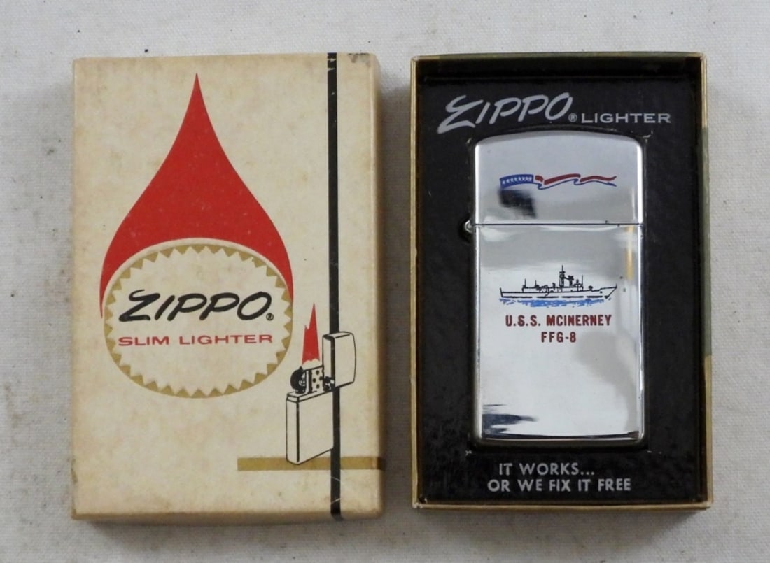 1979 UNFIRED SLIM ZIPPO U.S.S MCINERNEY LIGHTER: IN THE BOX, UNFIRED, HAS LOGO ON ONE SIDE AND SHIP ON THE OTHER, U.S.S MCINERNEY FFG-8
