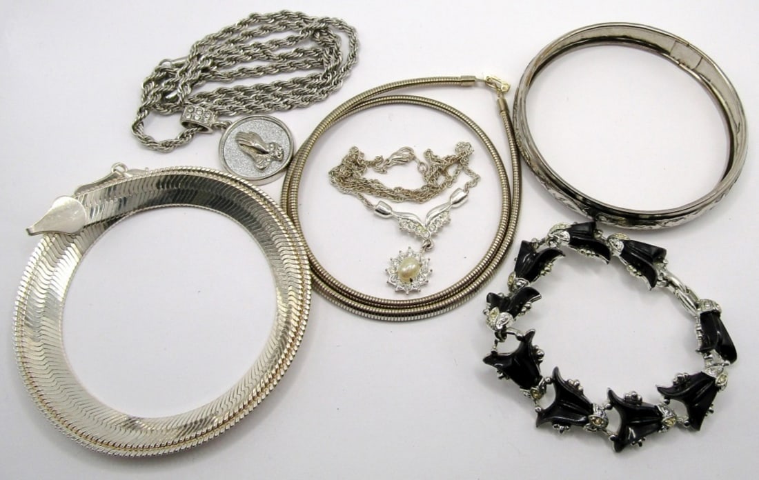 Silver Tone Fashion Jewelry Lot: Various style necklaces in various lengths (4). One bangle bracelet, one 7 inch clasp bracelet.