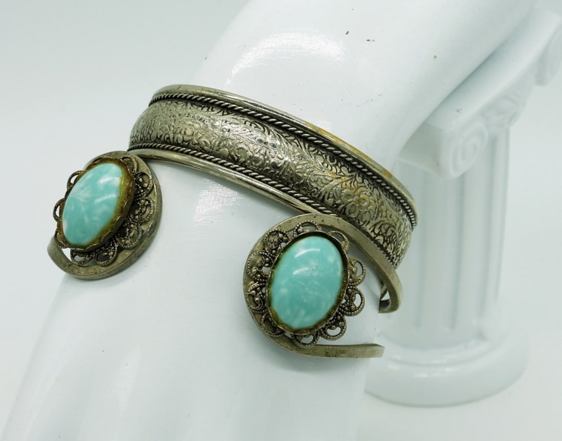 2 Silver Tone Cuff Bracelets: Two Silver Tone Cuff Style Bracelets, One with Turquoise Colored Gemstones. 6" & 7".