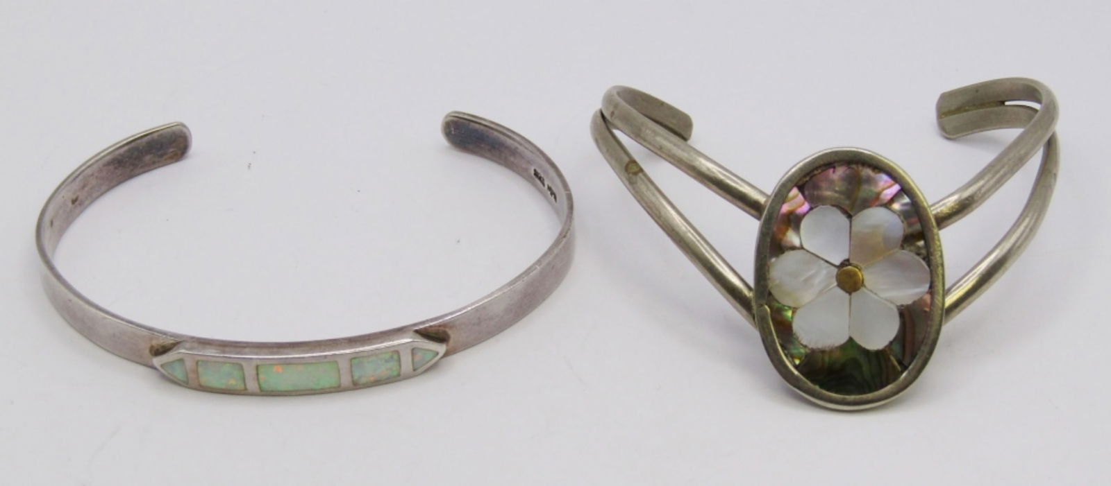 (2) INLAY CUFF BRACELETS: 18 DWT. 2" & 2.5" WITH ABALONE/MOTHER OF PEARL INLAY.