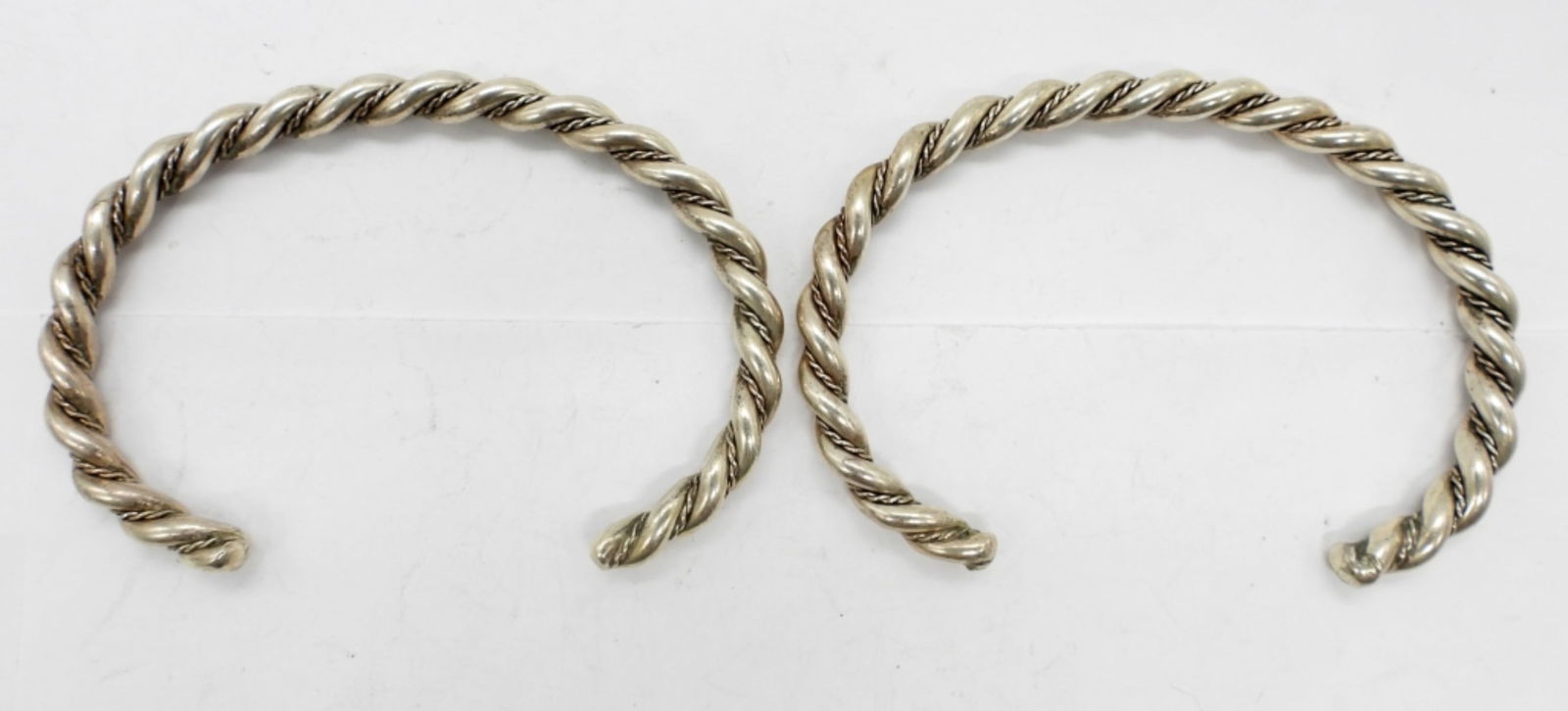 (2) TWISTED STERLING CUFF BRACELETS: 23.2 DWT. MATCHING 2.25" DIAMETER CUFFS.