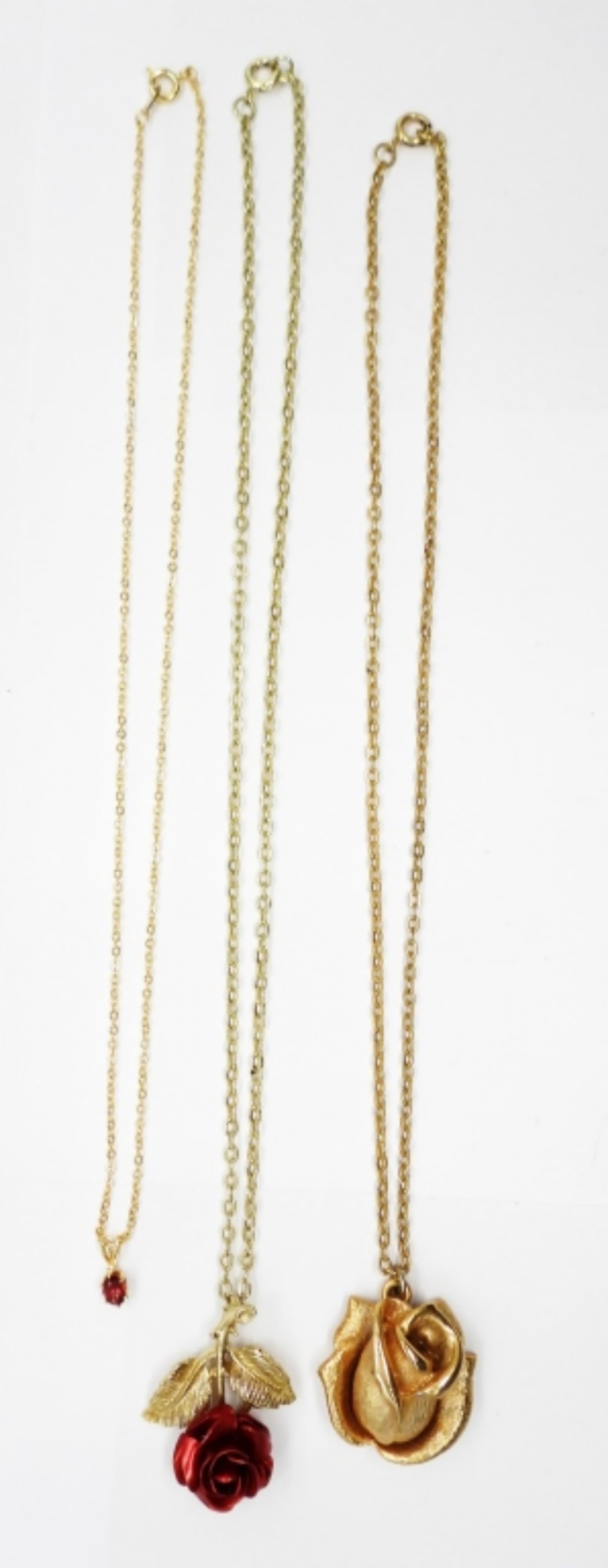 3 Rose Red Necklaces: Three Gold Tone Necklaces, Two with Rose Pendants and One Ruby Colored Gemstone. 16" & 18".