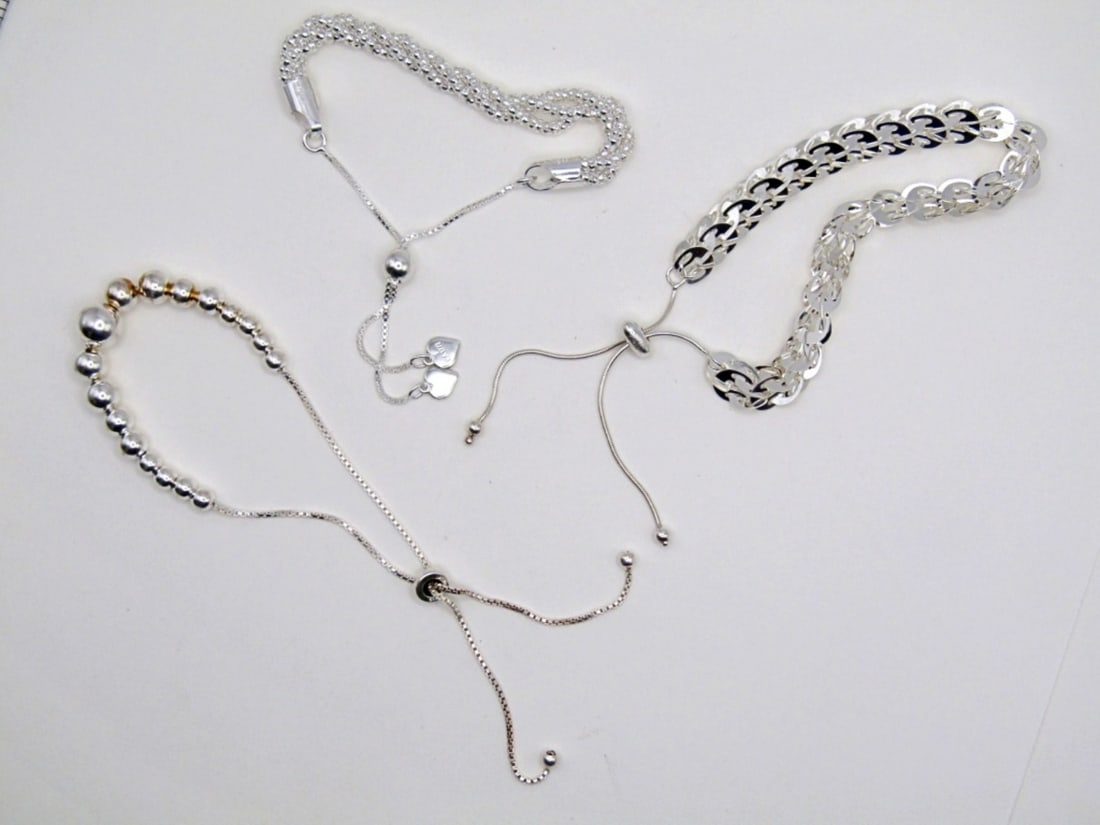 (3) ADJUSTABLE STERLING SILVER BRACELETS: 11 DWT. ALL STAMPED 925. LENGTHS ADJUSTABLE FROM: 4"-9", 3"-10", & 6"-10.5"