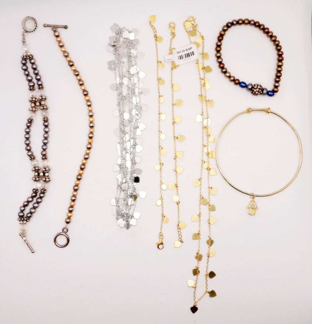 925 Mixed Gold & Silver Tone Boho Lot: Gold tone heart necklace 18 inches, silver tone heart necklace 50 inches, two chain bracelets and two beaded bracelets 7 inches, plus stretch bracelet and Hamsa Hand bangle bracelet. Super cute Boho s