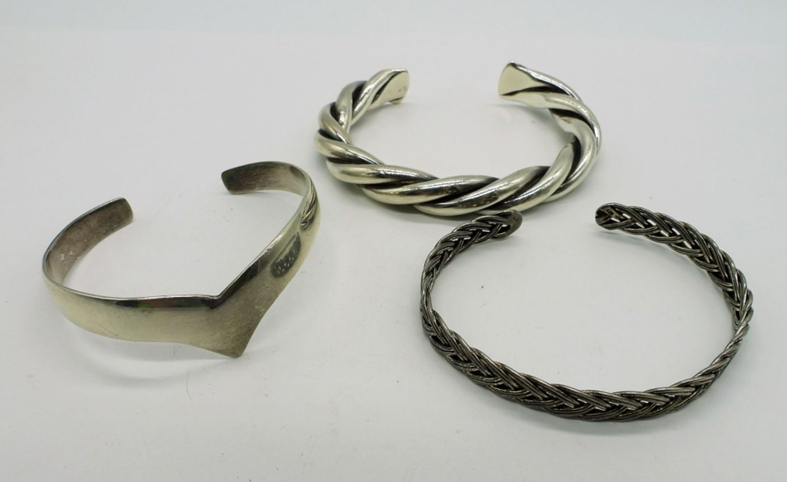 Vintage Sterling Cuff Bracelets: One twisted, one braided, and one smooth. (DWT 45.4)