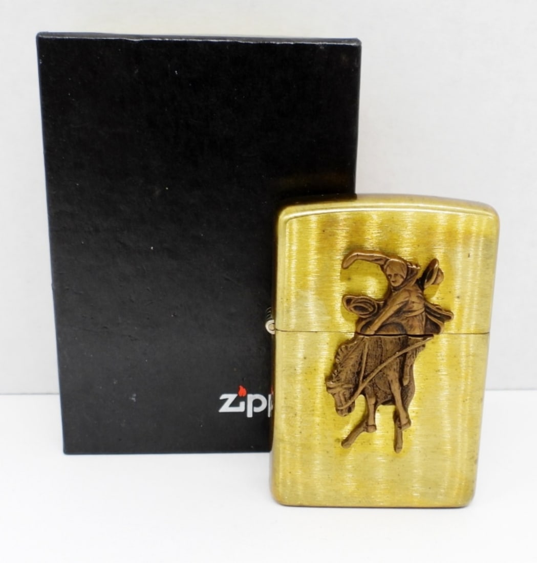 1993 SEALED BUCKING BRONCO RIDER ZIPPO: IN A ZIPPO BOX, SEALED, BRONZE COLOR