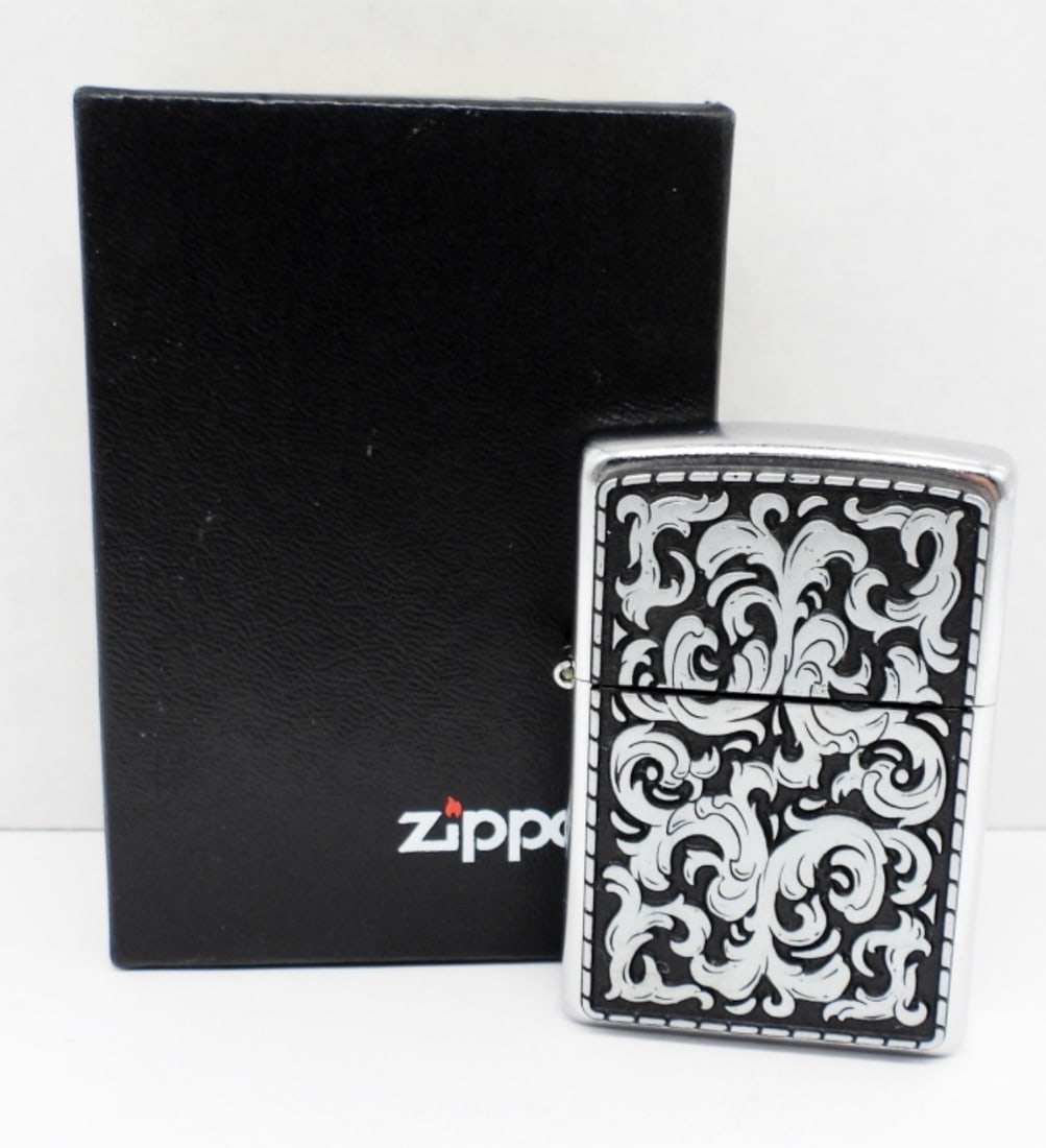 2003 UNFIRED ZIPPO LIGHTER: 2003, UNFIRED, IN A ZIPPO BOX, DESIGN ON THE FRONT