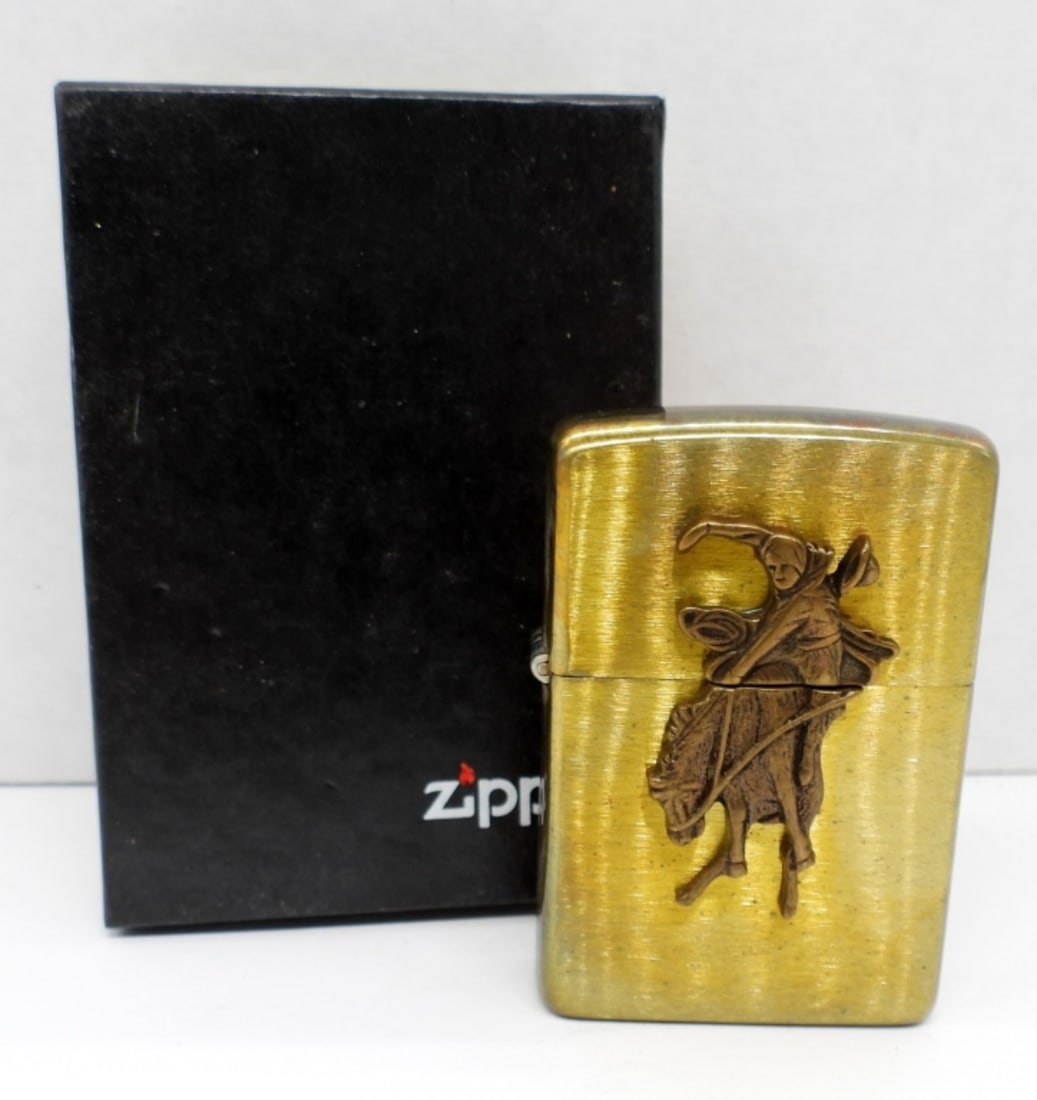 1993 SEALED BUCKING BRONCO RIDER ZIPPO: IN A ZIPPO BOX, SEALED, BRONZE COLOR