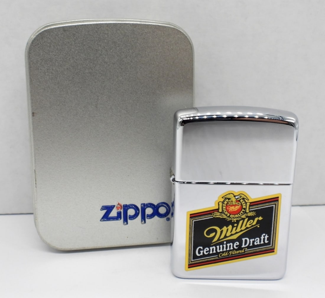 1996 FIRED MILLER BEER ZIPPO LIGHTER: FIRED, HAS THE MILLER GENUINE DRAFT LOGO ON THE FRONT