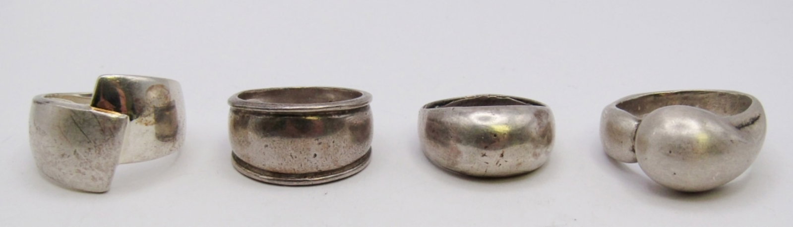 (4) VINTAGE STERLING SILVER RINGS: 23 DWT. (1) STAMPED 925. SIZES: 7.5, 8.5, 6.5, 7
