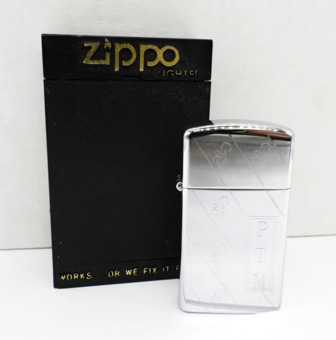 1984 FIRED SLIMED ETCHED ZIPPO LIGHTER: 1984 ETCHED PTM ON THE SIDE, IN A ZIPPO BOX