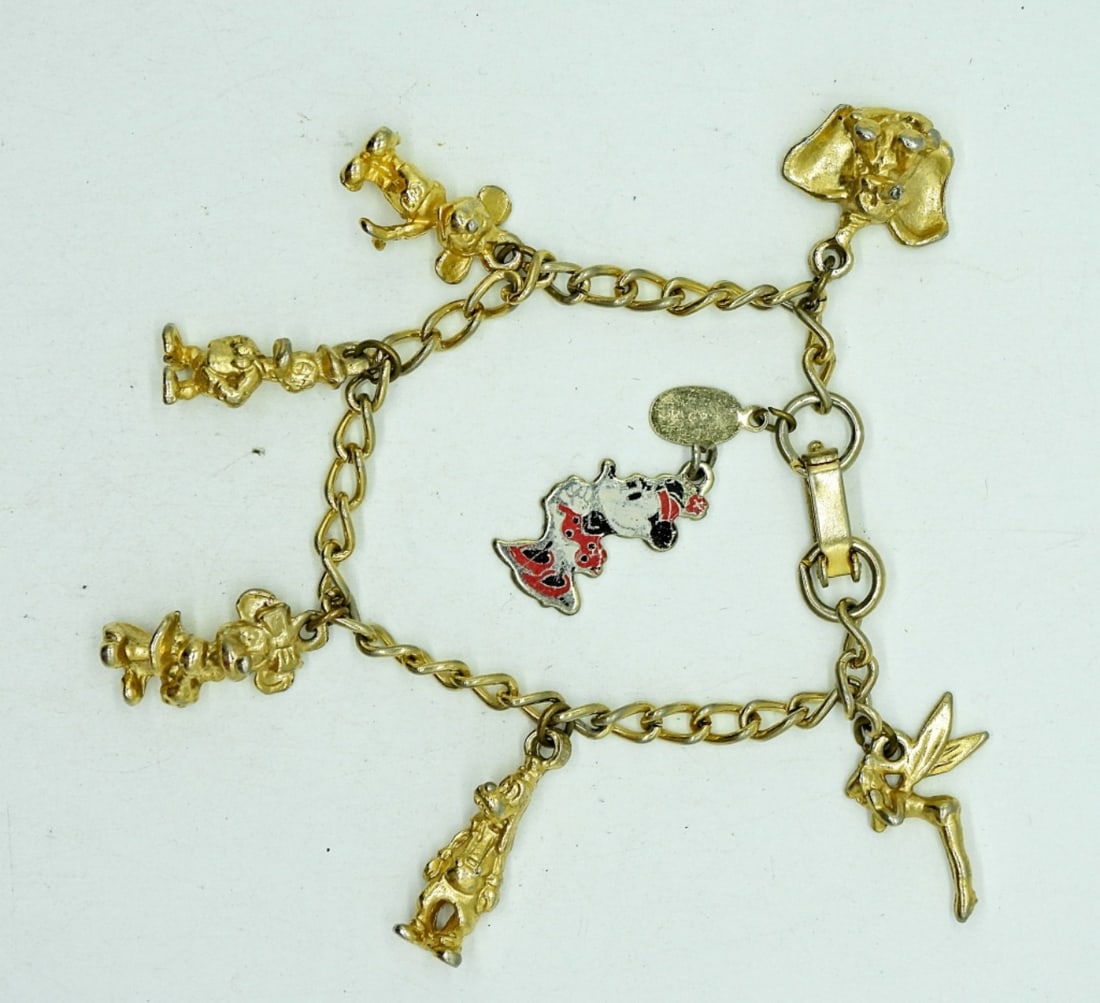 Vintage Gold Tone Disney Charm Bracelet: Vintage Gold Tone Disney Charm Bracelet with 7 Charms.