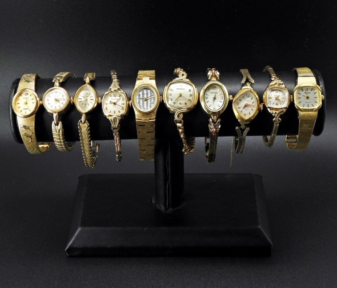10 VINTAGE NAME BRAND LADIES WATCHES: NOT TESTED AS TO WORKING OR NOT.- GOLD TONE. (1) BENRUS, (1)HAMILTON, (1) GRUEN, (2)ELGIN, (2)BULOVA, (3) WALTHAM