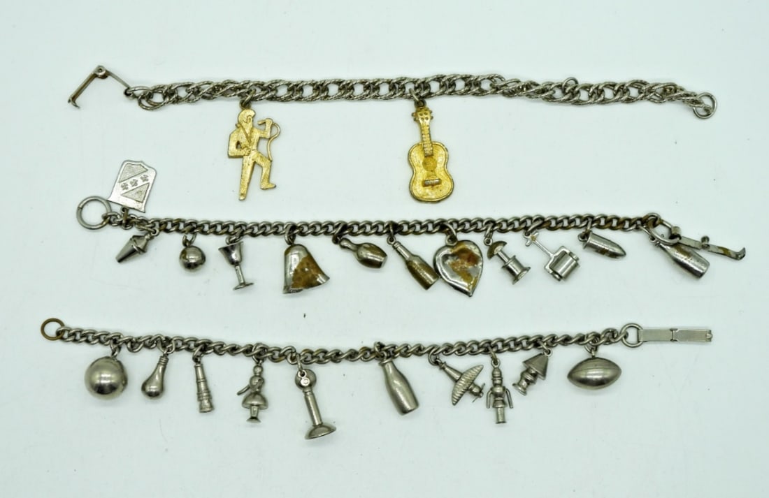 3 VINTAGE CHARM BRACELETS: TWO SILVER TONE SPORTS CHARM BRACELETS, 7". ONE SILVER & GOLD TONE ELVIS CHARM BRACELET(Elvis Charms Stamped 1977).