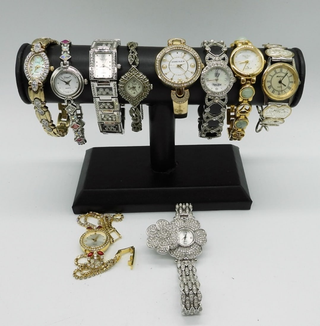 10 FANCY VINTAGE LADIES WATCHES: 10 GOLD AND SILVER TONE, FANCY WATCHES WITH GEMSTONES. ALL VERY PRETTY AND SPARKLY. ANNE KLEIN, MONTANA, VIVANI, XANADU, DMQ, VICTORIA WIECK, MAIN LINE TIME. SEE PHOTOS (NOT TESTED AS TO WORKING OR NO