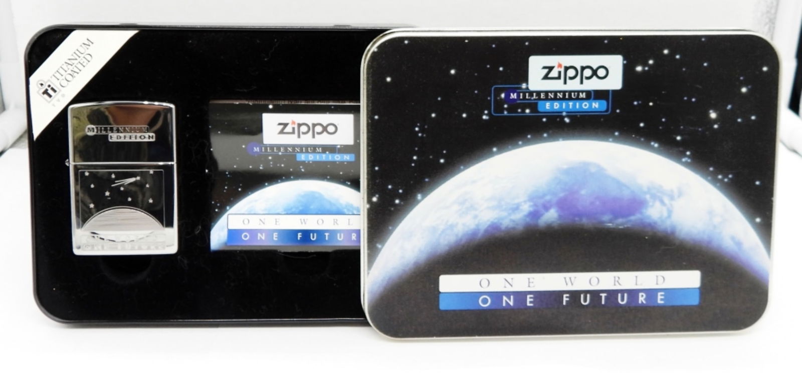 SEALED 1999 ZIPPO MILLENNIUM EDITION ONE WORLD: SEALED, IN THE ORIGINAL TIN BOX AND SLEEVE, TITANIUM COATED