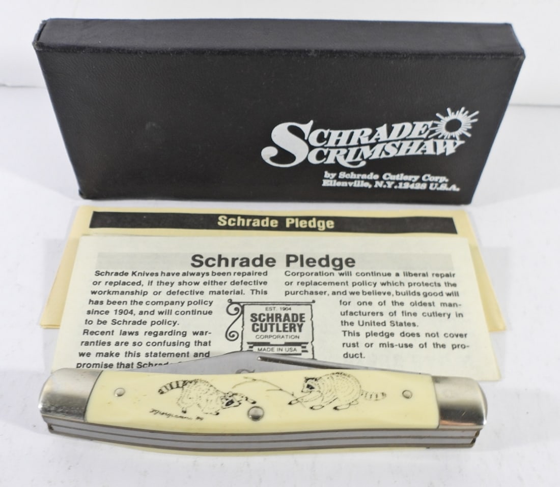 SCHRADE RACCOON POCKET KNIFE: SCHRADE SCRIMSHAW 505 SC POCKET KNIFE WITH RACCOONS ON IT. ORIGINAL BOX AND PAPERS. VERY NICE.