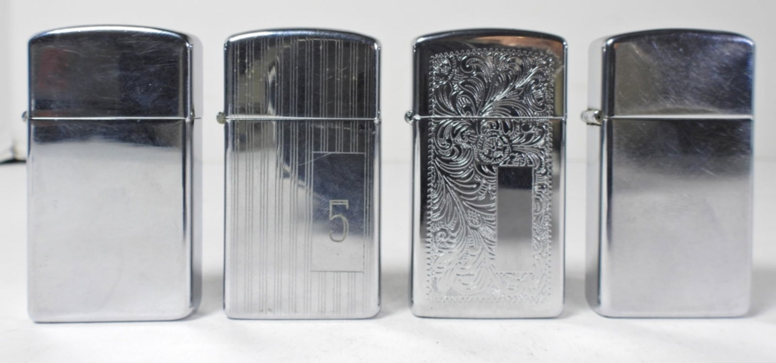 (4) SLIM ZIPPO LIGHTERS (1 of 4)
