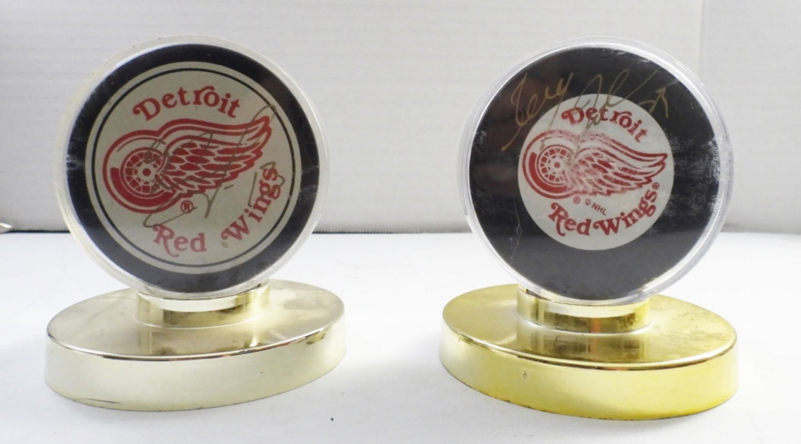 (2) DETROIT RED WINGS SIGNED PUCKS (1 of 4)